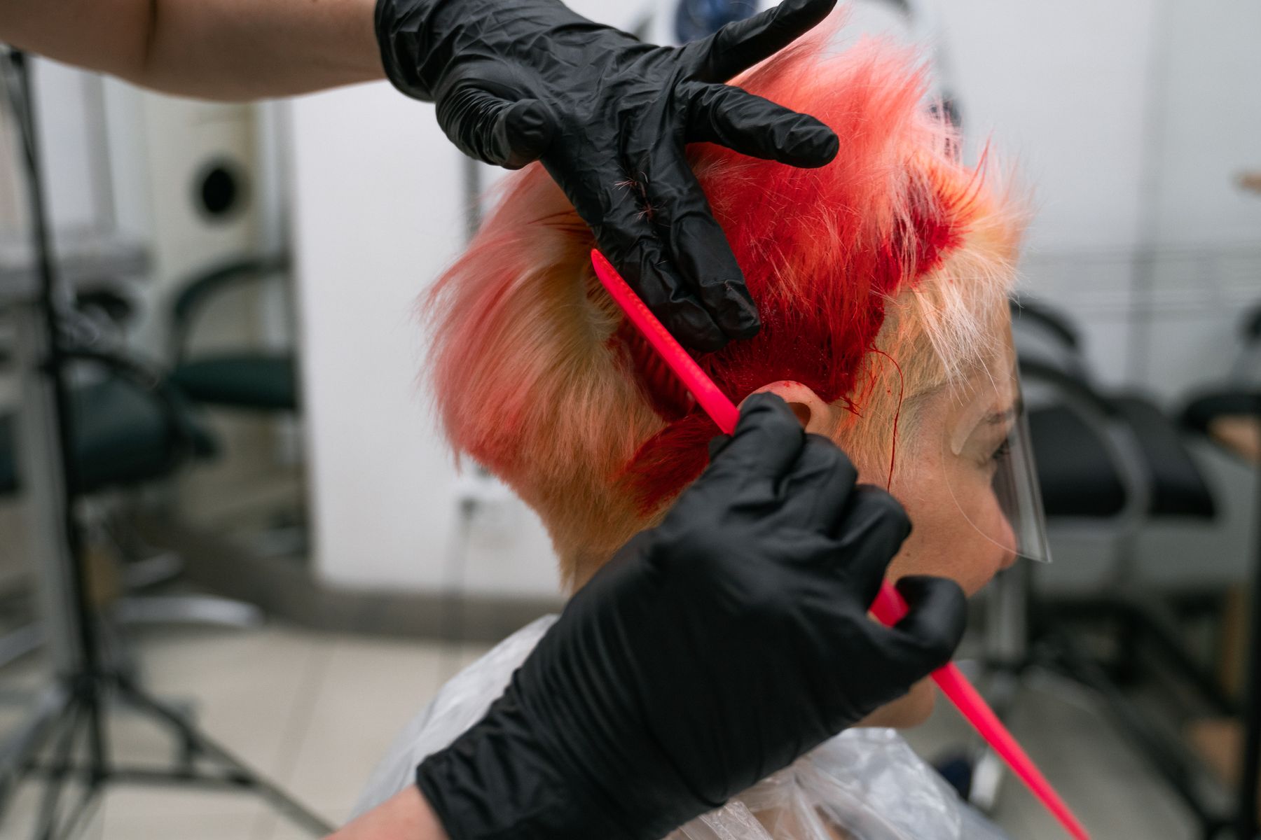 Hair colour being applied with a brush